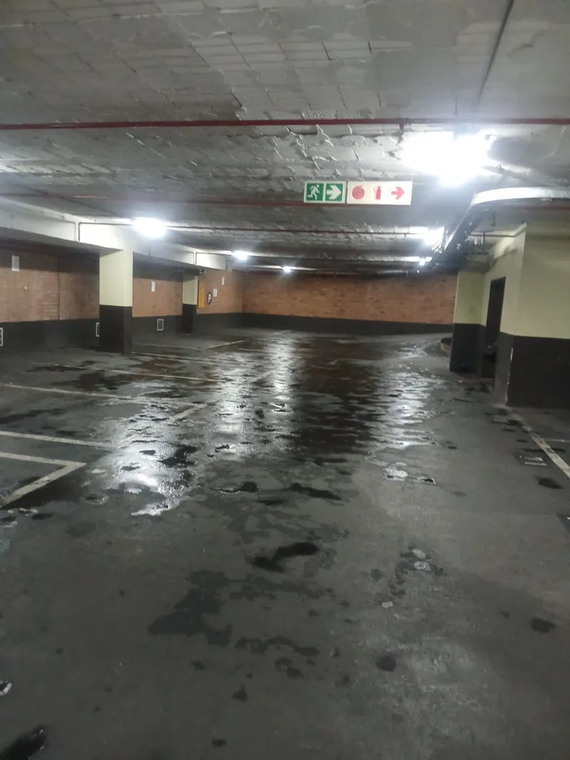 A wet floor in an underground parking garage after flooding